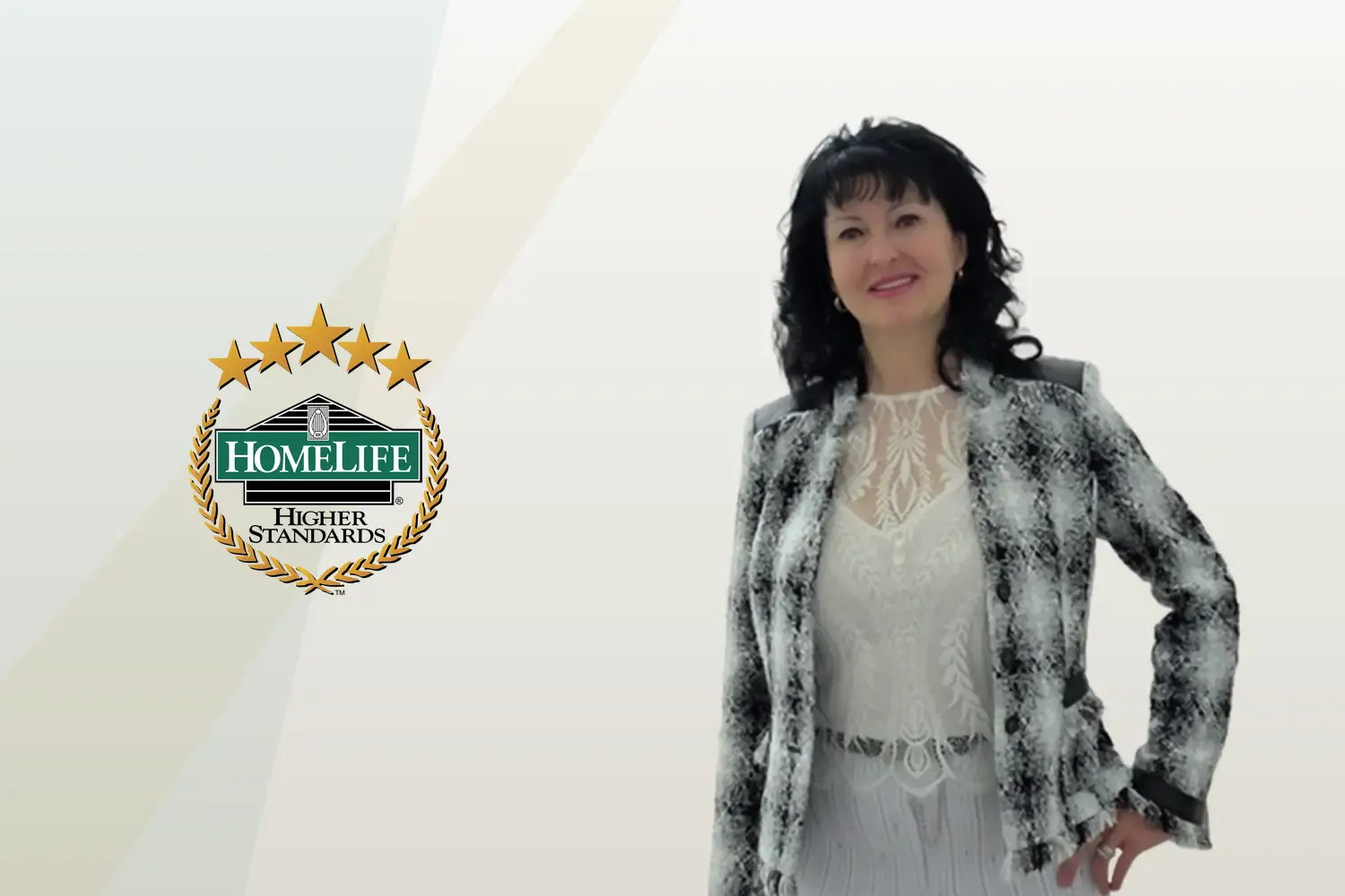 Julia Stanford, Broker of Record and Owner, beside the HomeLife logo in Niagara Falls, Ontario
